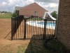 Style RAB Black aluminum fence. Pool code and arched gates