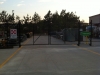 Black vinyl chain link Commercial fencing and cantilever gate
