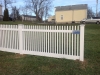 White PVC Pickett and solid board fence with gates and New England caps