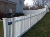 White PVC Pickett and solid board fence with gates and New England caps