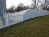 White PVC Pickett and solid board fence with gates and New England caps