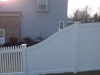 White PVC Pickett and solid board fence with gates and New England caps